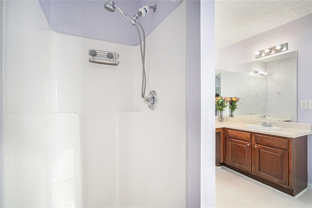 bathroom with vanity and walk in shower