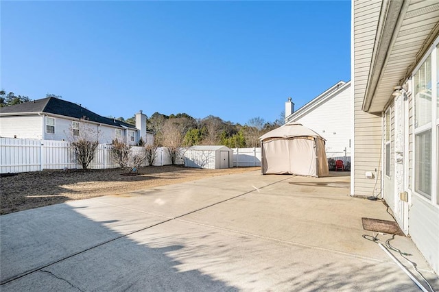 view of patio with a storage shed