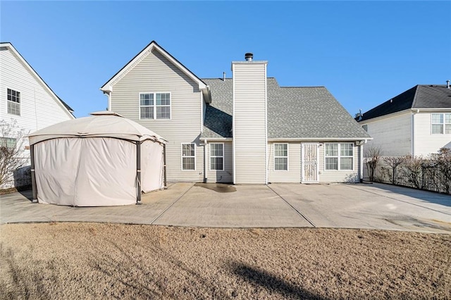 rear view of house with a patio