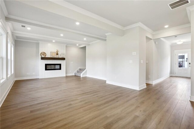 corridor with crown molding and light hardwood / wood-style flooring