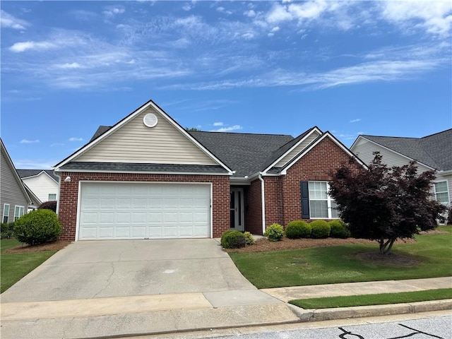 802 Village Pl, Loganville, GA 30052 - view of front of house featuring brick siding, a garage, driveway, and a front lawn