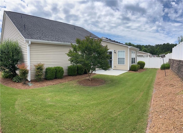 802 Village Pl, Loganville, GA 30052 - rear view of property featuring a patio and a shingled roof