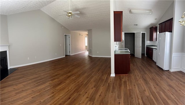 802 Village Pl, Loganville, GA 30052 - kitchen with white appliances, open floor plan, lofted ceiling, a ceiling fan, and light countertops