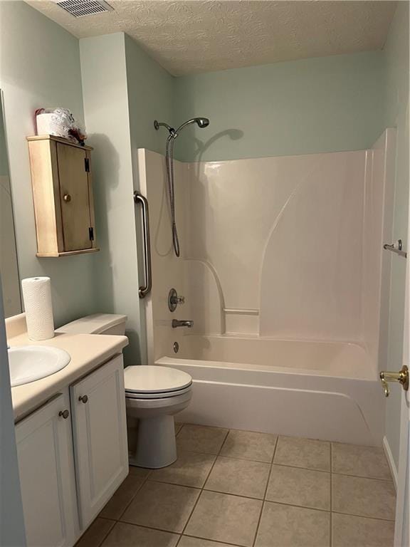 802 Village Pl, Loganville, GA 30052 - full bath with vanity, bathtub / shower combination, toilet, tile patterned floors, and a textured ceiling