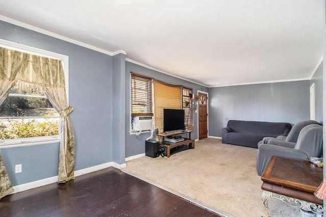 living room with ornamental molding, cooling unit, baseboards, and wood finished floors