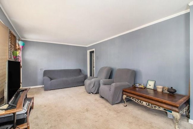 carpeted living area featuring ornamental molding