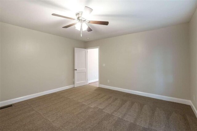 carpeted empty room with ceiling fan