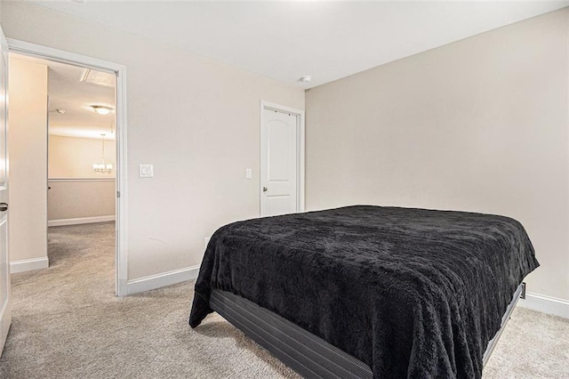 bedroom with baseboards and light colored carpet