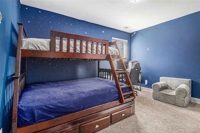 bedroom with carpet flooring, visible vents, and baseboards