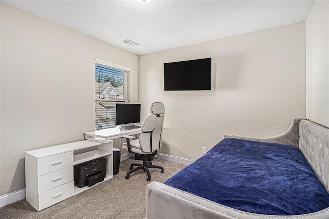 bedroom featuring light carpet, visible vents, and baseboards