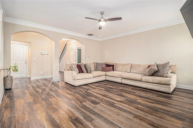 living area featuring visible vents, arched walkways, baseboards, stairway, and dark wood-style flooring