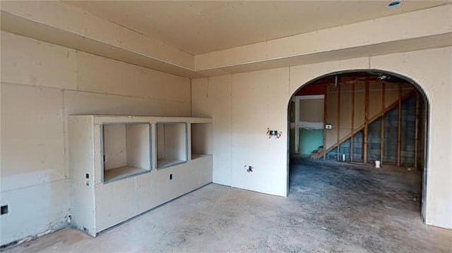 unfurnished room featuring concrete flooring