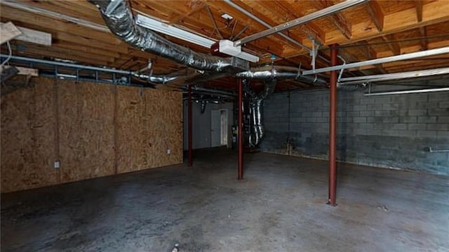 basement featuring heating unit