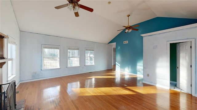 unfurnished living room with ceiling fan, lofted ceiling, and light hardwood / wood-style floors