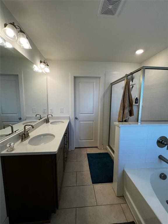 bathroom featuring a sink, walk in shower, visible vents, and tile patterned floors