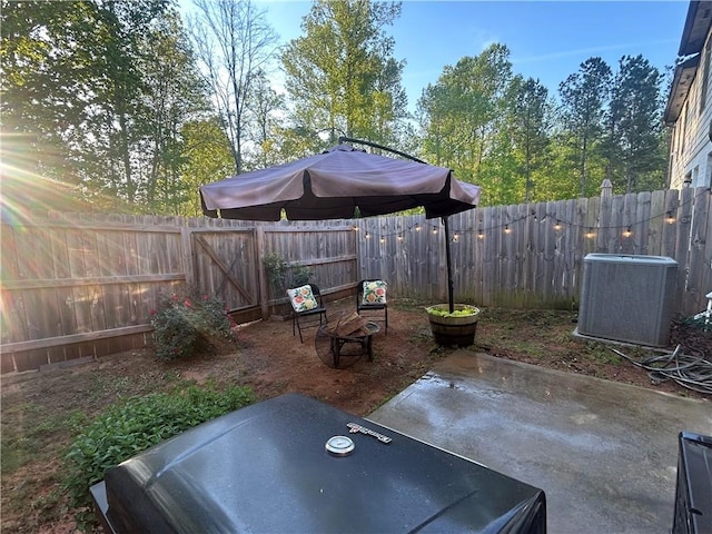 view of patio with central AC and a fenced backyard