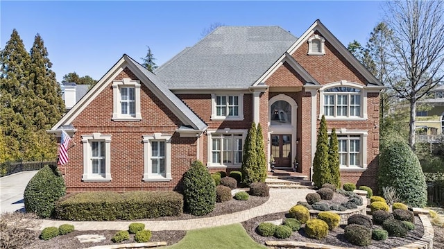 view of front of house with brick siding