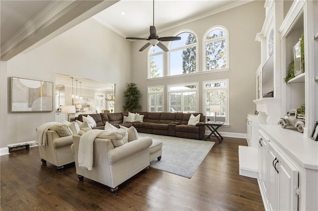 living area featuring crown molding, dark wood finished floors, baseboards, and ceiling fan