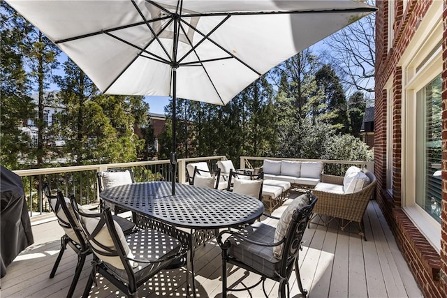 wooden deck with outdoor dining space and an outdoor living space