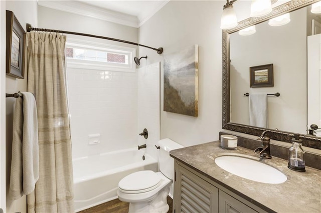 bathroom featuring toilet, shower / bath combo with shower curtain, crown molding, and vanity