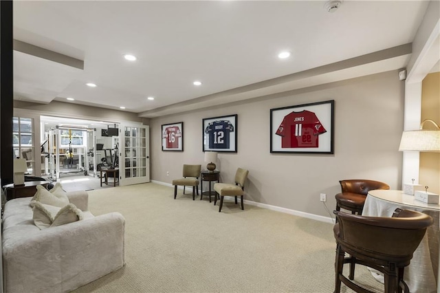 living area with carpet, baseboards, and recessed lighting