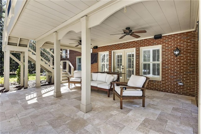 view of patio with a ceiling fan, stairway, and an outdoor hangout area