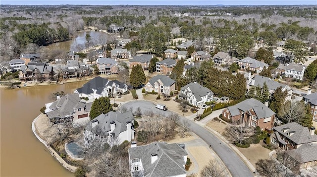 drone / aerial view featuring a residential view and a water view