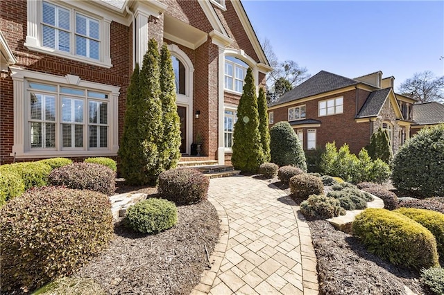 property entrance with brick siding