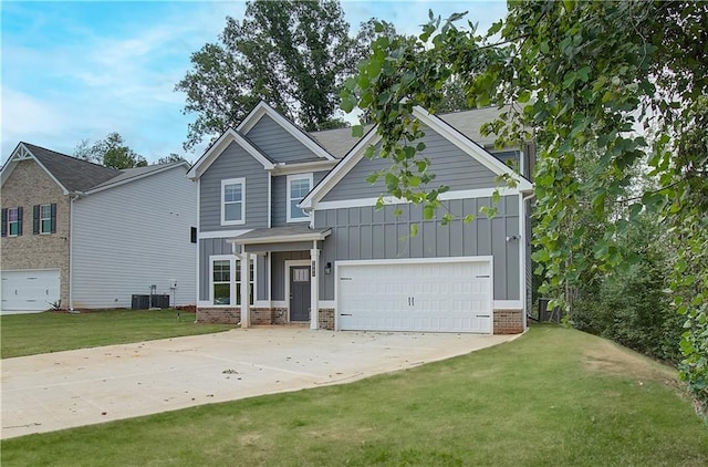 craftsman house with a front lawn, central AC unit, and a garage