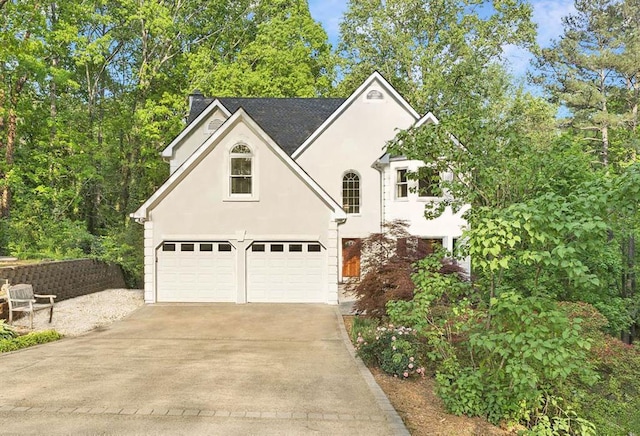 601 Ashley Forest Dr NW, Acworth, GA 30102 - view of front of house featuring stucco siding, concrete driveway, and an attached garage