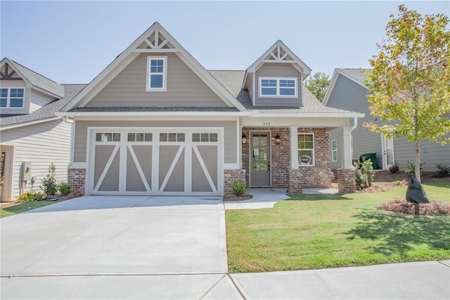 craftsman inspired home featuring a garage and a front yard