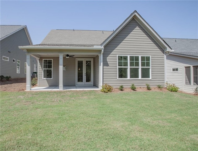 back of property featuring ceiling fan, a yard, a patio area, and french doors