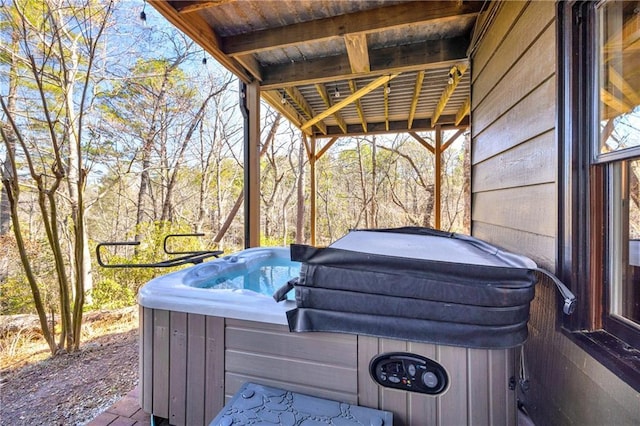 exterior space with a hot tub