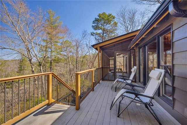 deck with a sunroom