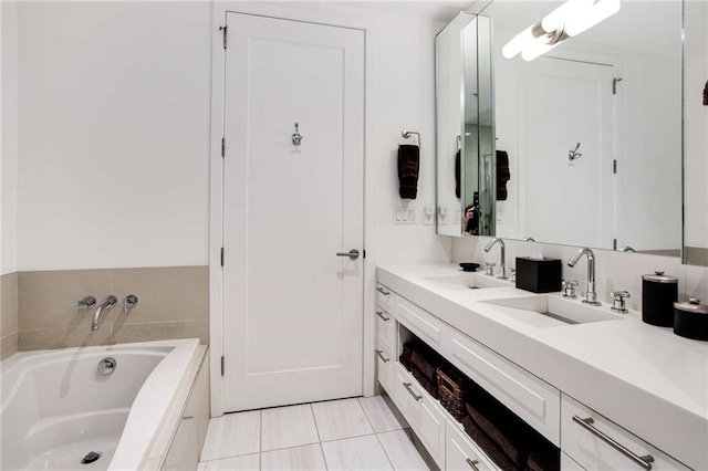 bathroom featuring vanity, tile patterned floors, and a tub to relax in