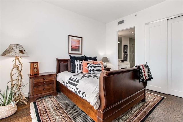 bedroom featuring hardwood / wood-style flooring and a closet