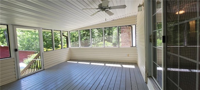 unfurnished sunroom with ceiling fan and lofted ceiling