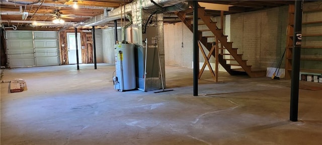 basement with gas water heater and stairs