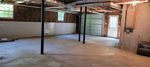 basement featuring brick wall