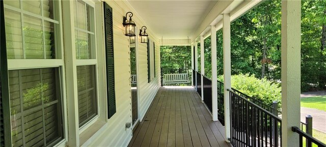 wooden terrace featuring a porch