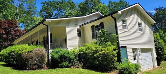 view of property exterior featuring an attached garage