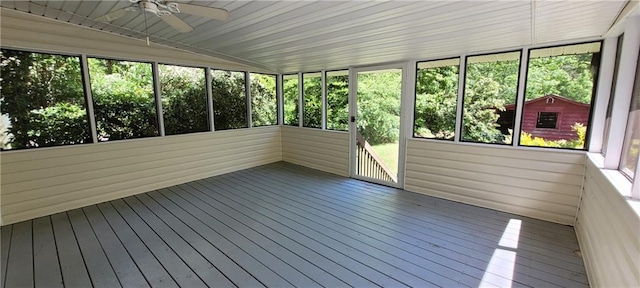 unfurnished sunroom featuring ceiling fan