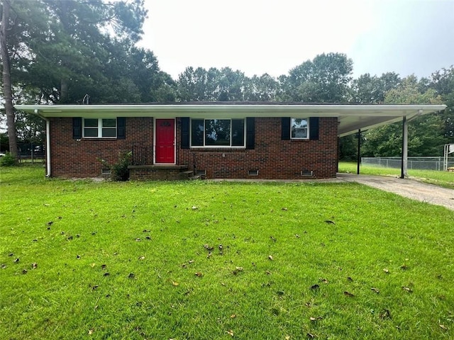 view of front facade featuring a carport and a front yard