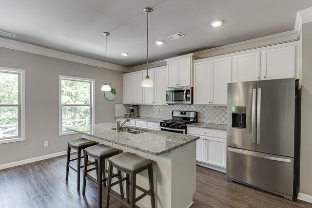 kitchen with stainless steel appliances, visible vents, a wealth of natural light, and a sink
