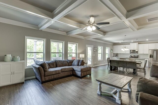 living room with a ceiling fan, baseboards, visible vents, and coffered ceiling