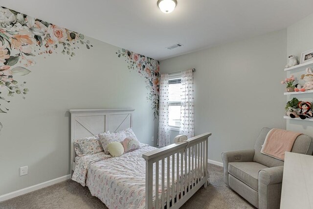 carpeted bedroom with baseboards and visible vents