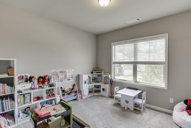 game room featuring baseboards, visible vents, and carpet