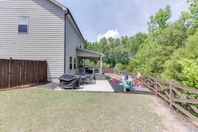 view of yard with a patio and a fenced backyard