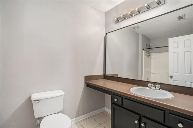 bathroom featuring visible vents, toilet, tile patterned flooring, a textured ceiling, and vanity