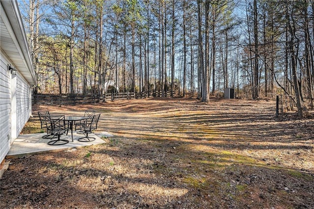 view of yard featuring a patio area and fence